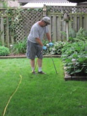 Curt administering fertilizer